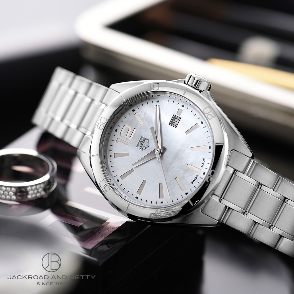 TAG Heuer watch with mother-of-pearl dial and silver bracelet