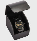 Black AX watch in display case