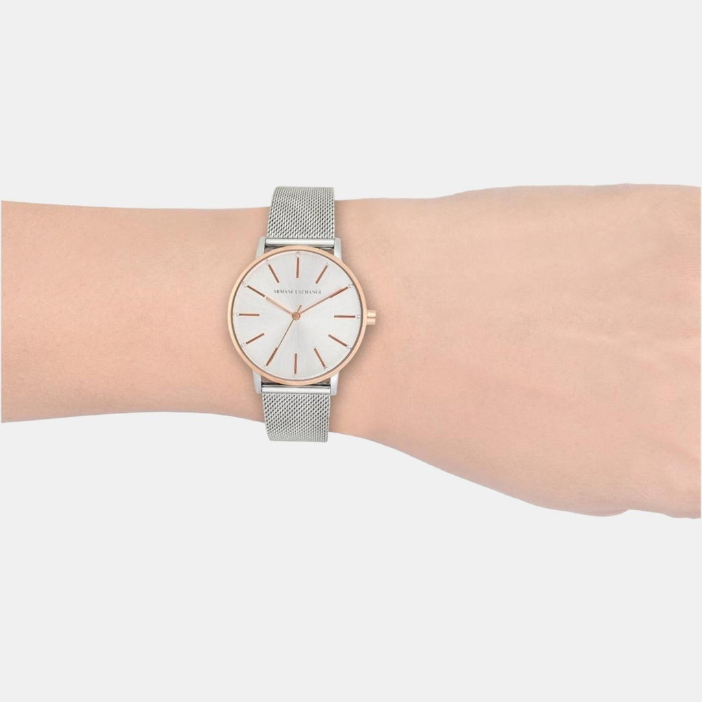 Silver and rose gold watch on wrist