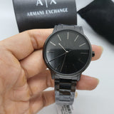 Black Armani Exchange watch on a hand.