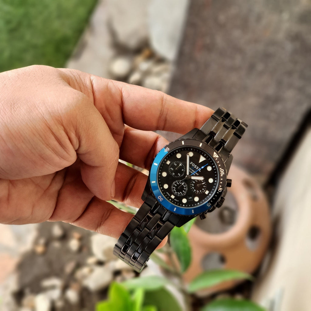 Fossil watch with black strap and blue accents