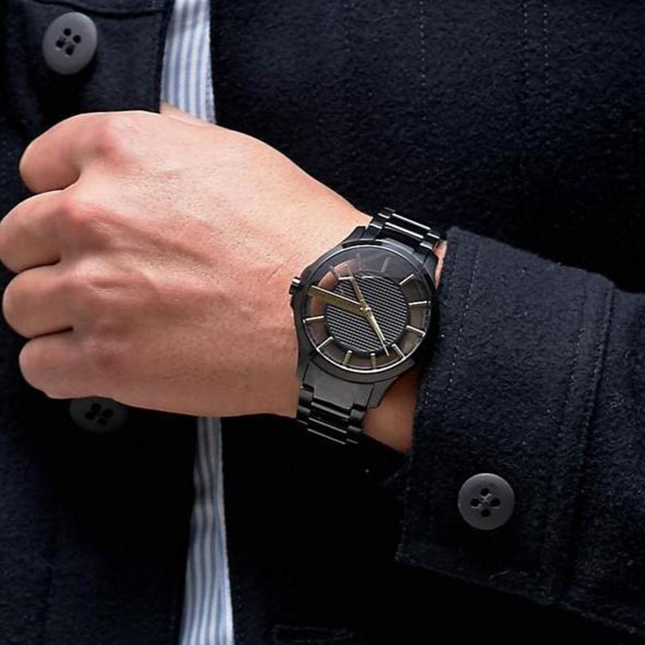 Black wristwatch on wrist