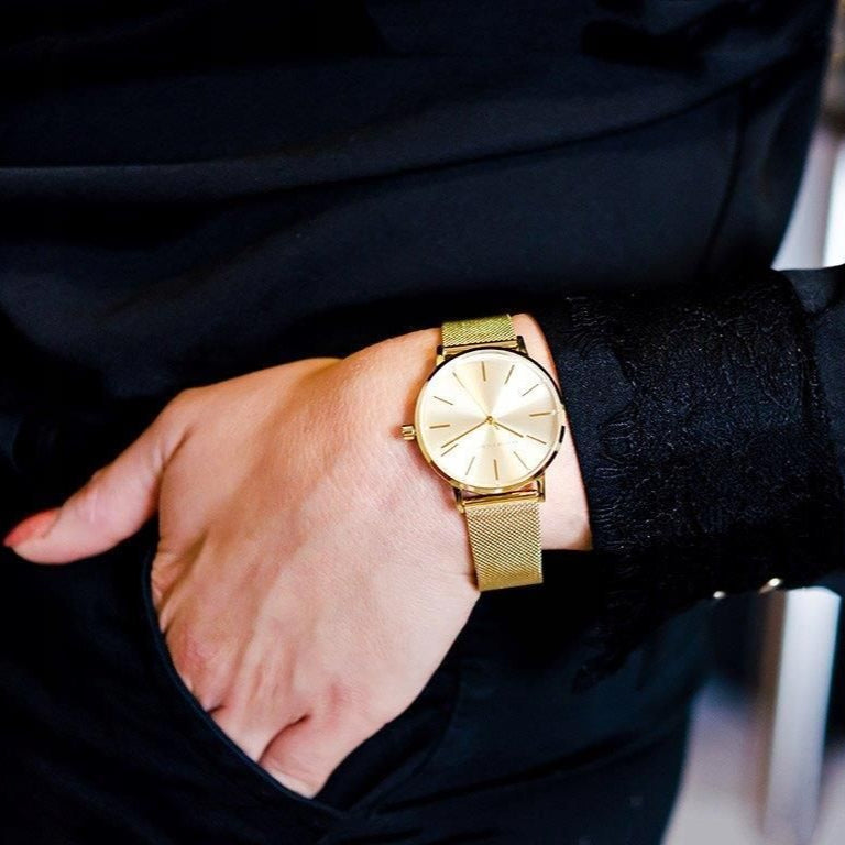 Armani Exchange AX5536 gold watch on wrist