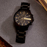 Black AX Armani Exchange watch on gray surface