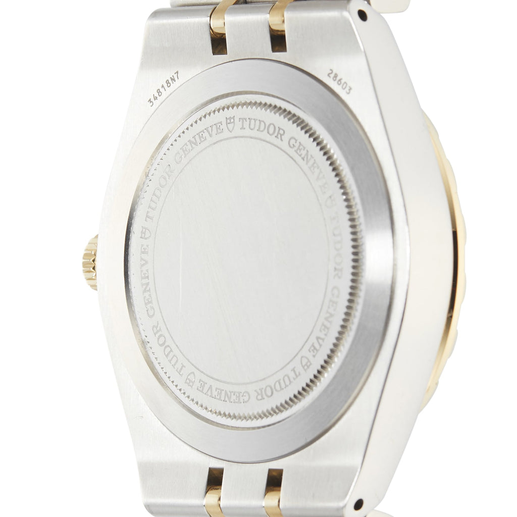 Back of a silver and gold wristwatch.