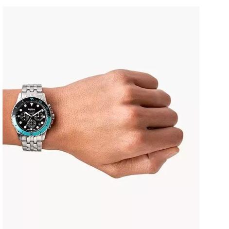 Wrist with a silver watch showing time.