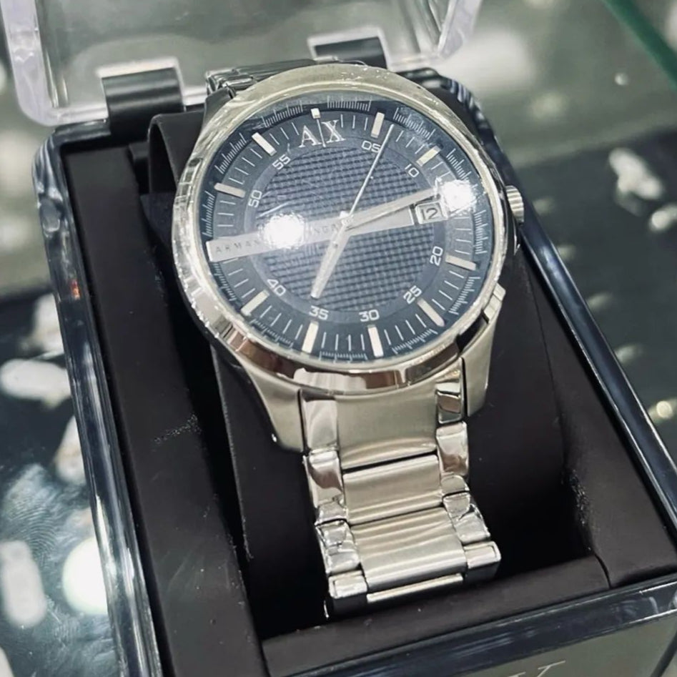 Silver wristwatch in a black box.