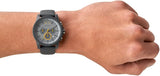 Grey AX watch on wrist