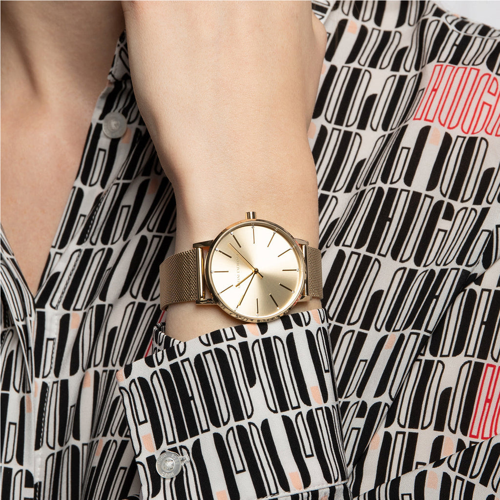 Gold watch on wrist, stylish fashion accessory