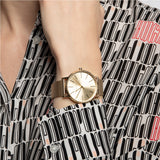 Gold watch on wrist, stylish fashion accessory