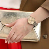 Gold watch and clutch, style 5xjcyeoc