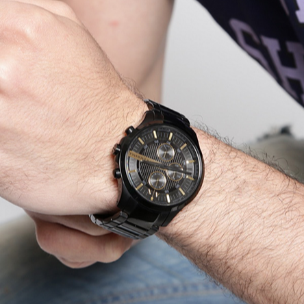 Black wristwatch on wrist