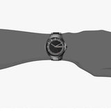 Man's wrist wearing modern silver watch.