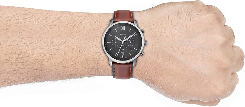 Fossil men's watch on wrist with brown leather band