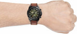 Man wearing a black watch with brown leather strap - 71EVGMl0H3L