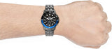 Watch on wrist with blue bezel, 71hkrLBIWvS.