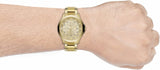 Gold watch on wrist, product photo