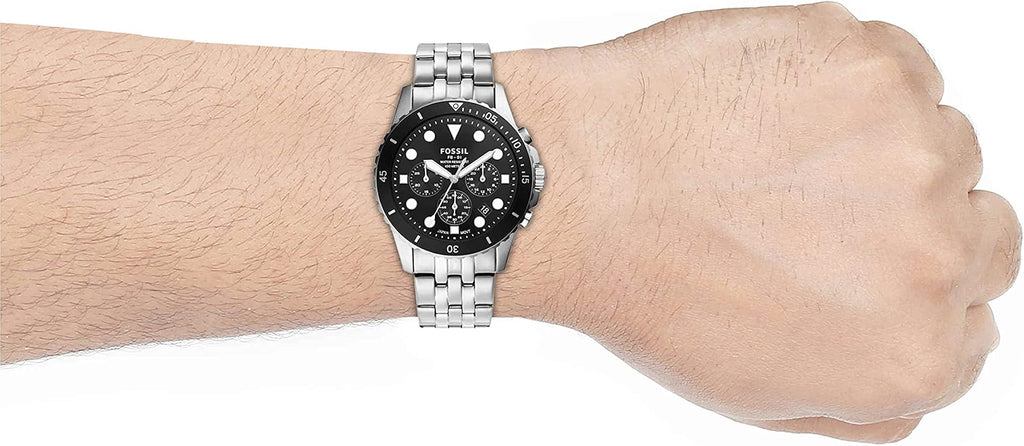 Silver watch on wrist, product image.