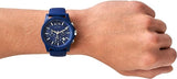 Blue Armani Exchange watch on wrist.