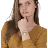 Woman wearing gold watch