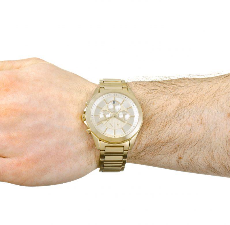 Gold watch on wrist