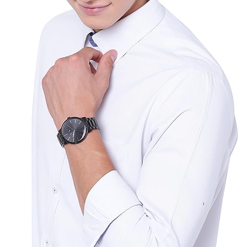 Man wearing black watch and white shirt