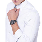 Man wearing black watch and white shirt