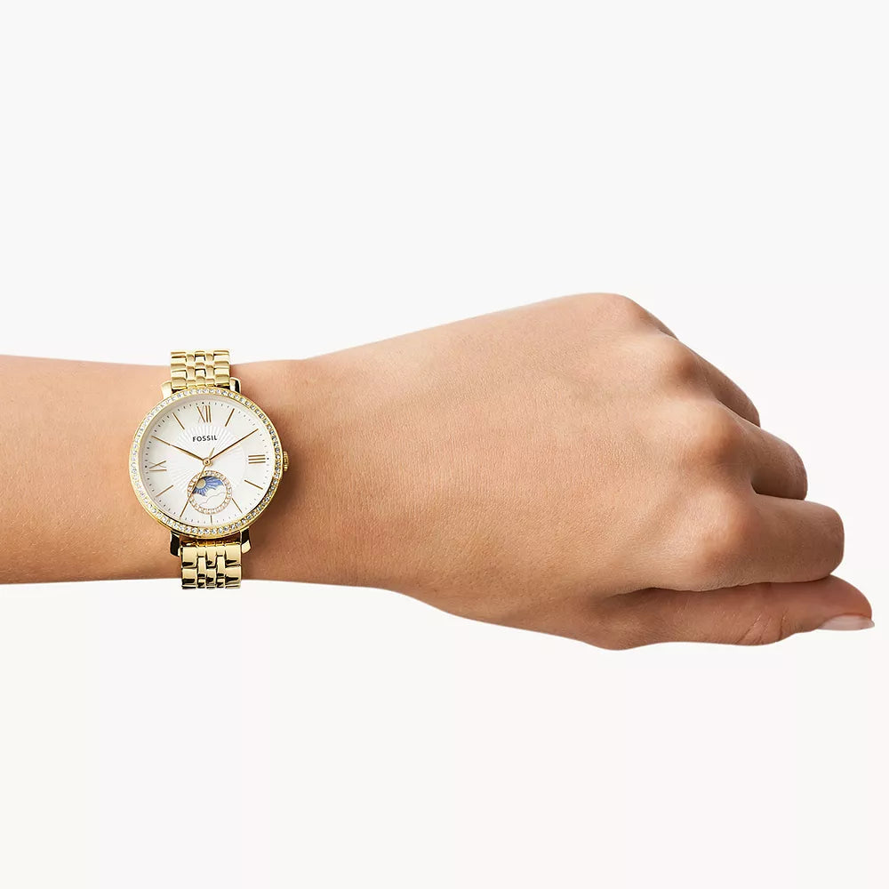 Gold Fossil watch on wrist