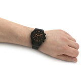 Black wristwatch on wrist