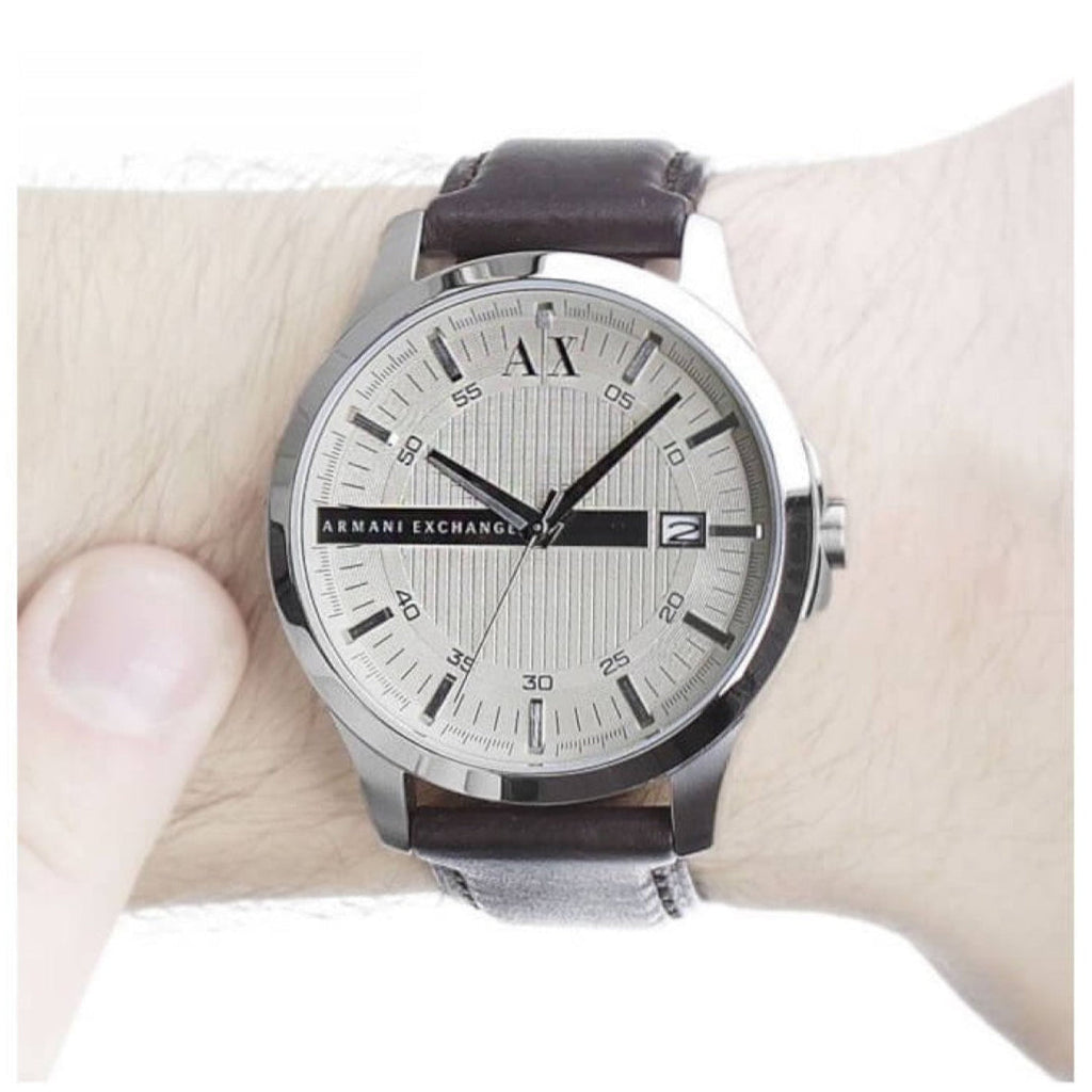 Armani Exchange AX2100-3 watch on wrist with silver dial and leather strap