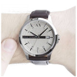 Armani Exchange AX2100-3 watch on wrist with silver dial and leather strap