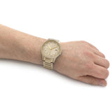 AX2415 gold watch on wrist