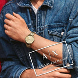 Armani Exchange gold watch AX2707 on wrist