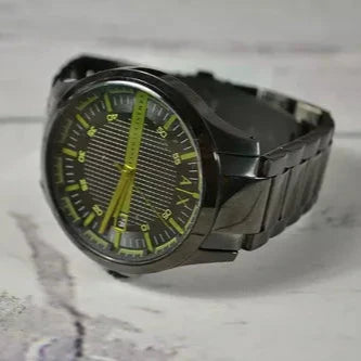 Black A|X watch with green accents
