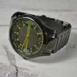 Black A|X watch with green accents