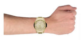 Gold wristwatch on wrist.