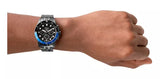 Man's wrist wearing a black and blue watch, product photo MCO50407017792.