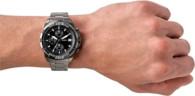 FS5852 Men's watch on wrist with black dial and stainless steel band.