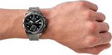 FS5852 Men's watch on wrist with black dial and stainless steel band.