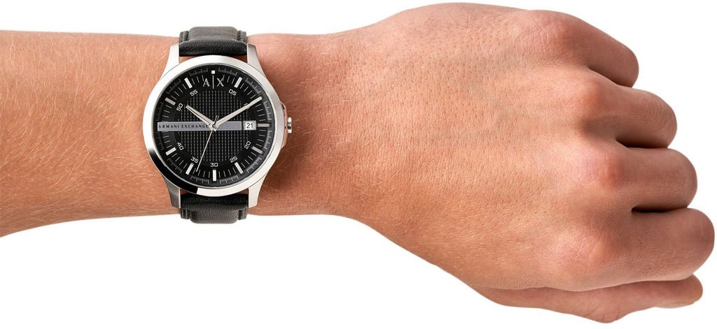 Men's black dial watch on wrist