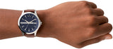 KHO11914-05 watch on wrist, blue face with brown leather strap.