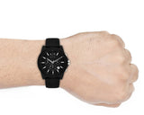 A|X Armani Exchange men's black watch on wrist