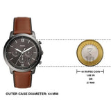 Fossil watch with brown leather strap, 44mm case, shown with 10 rupee coin.
