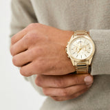Gold wristwatch on wrist