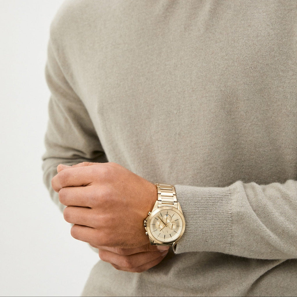 Gold watch on wrist, RTLAAV091201