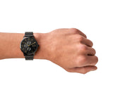 Armani Exchange black watch on wrist