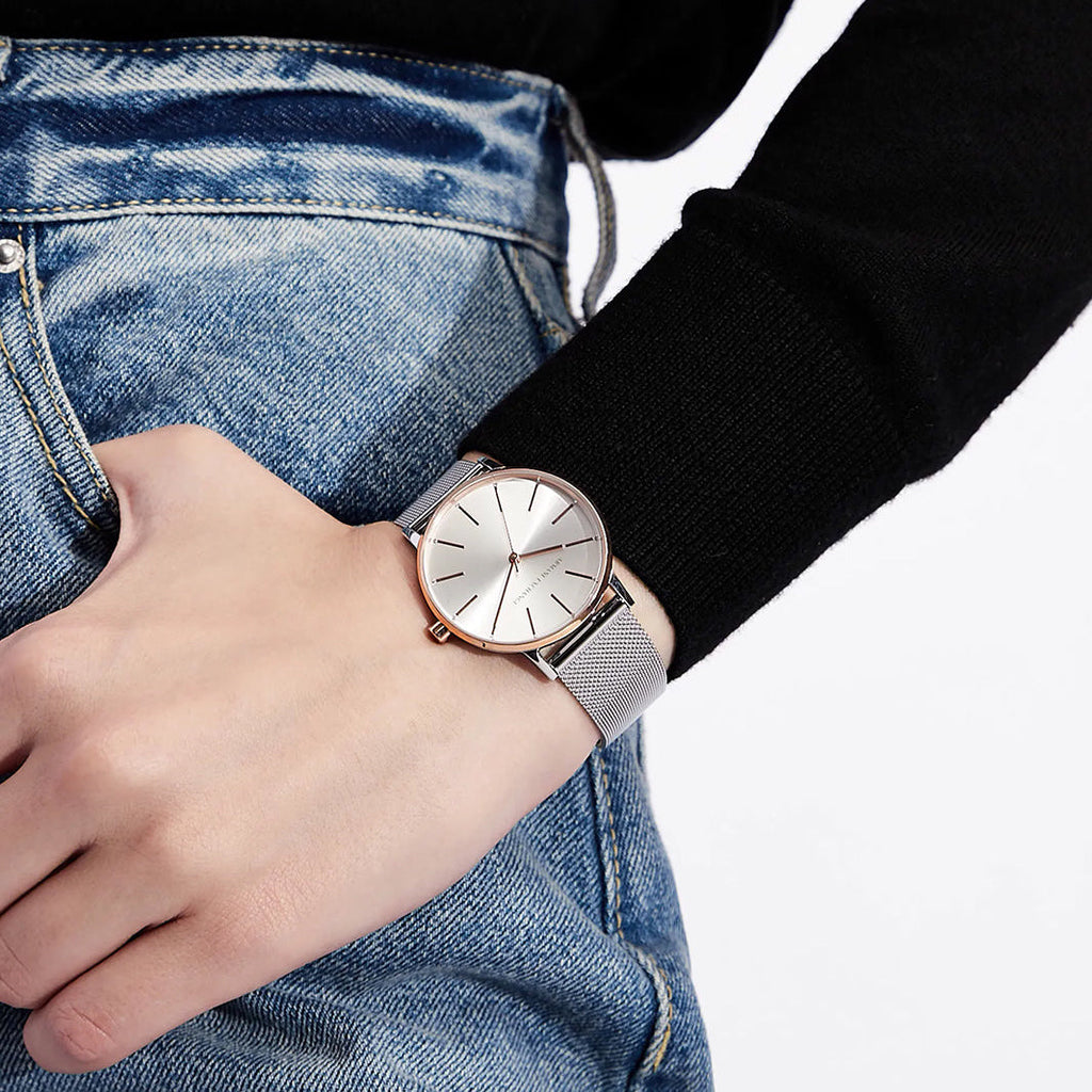 Armani Exchange AX5537 silver watch on wrist, classic fashion style.