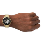 AX27473P10 gold watch on wrist