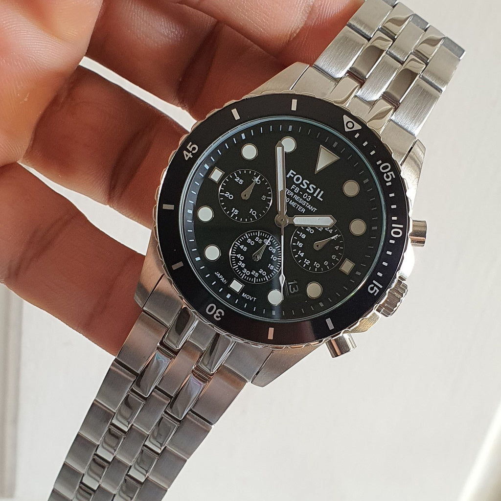 Fossil watch with black face and silver band