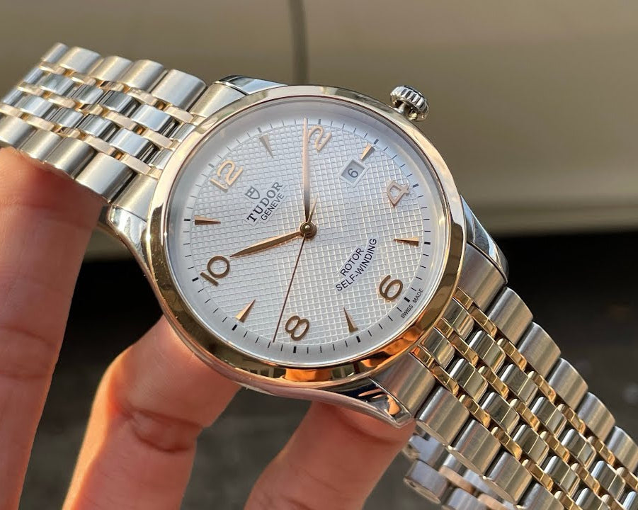 Tudor watch, hq720_9181dc82, gold and silver band, white face